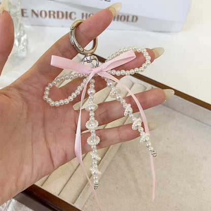 2026 New Korean Fashion Sweet Pearl Bow Keychain, Pearl Bow Keychain – Elegant Coquette Bag Charm with Pink Ribbon