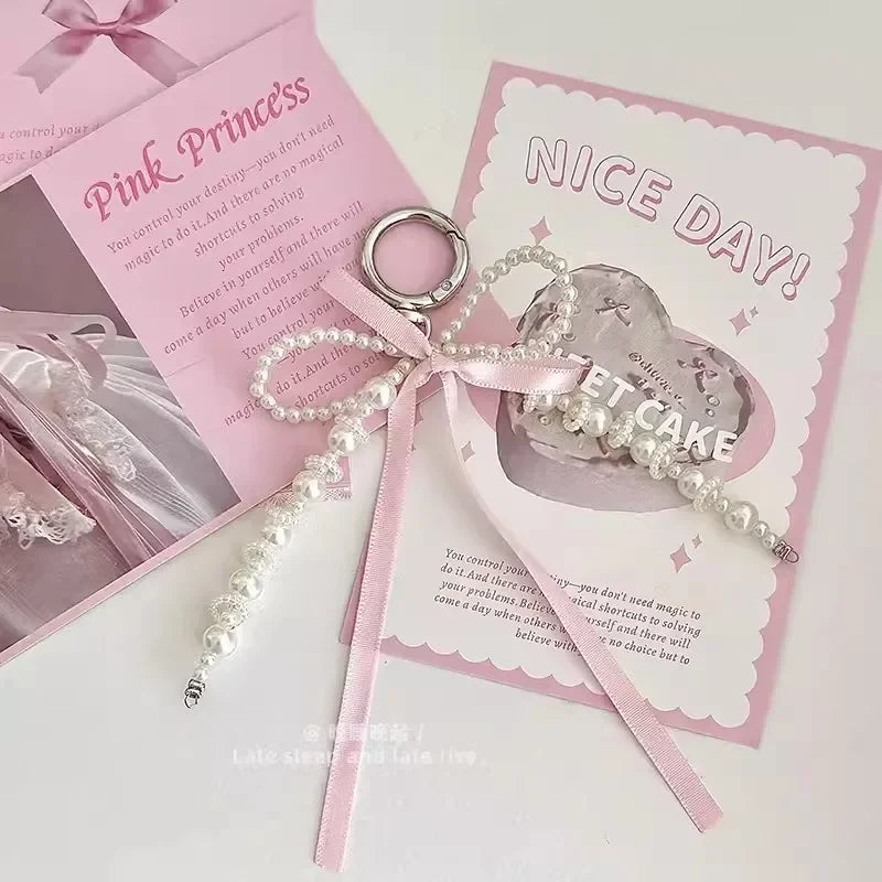 2026 New Korean Fashion Sweet Pearl Bow Keychain, Pearl Bow Keychain – Elegant Coquette Bag Charm with Pink Ribbon