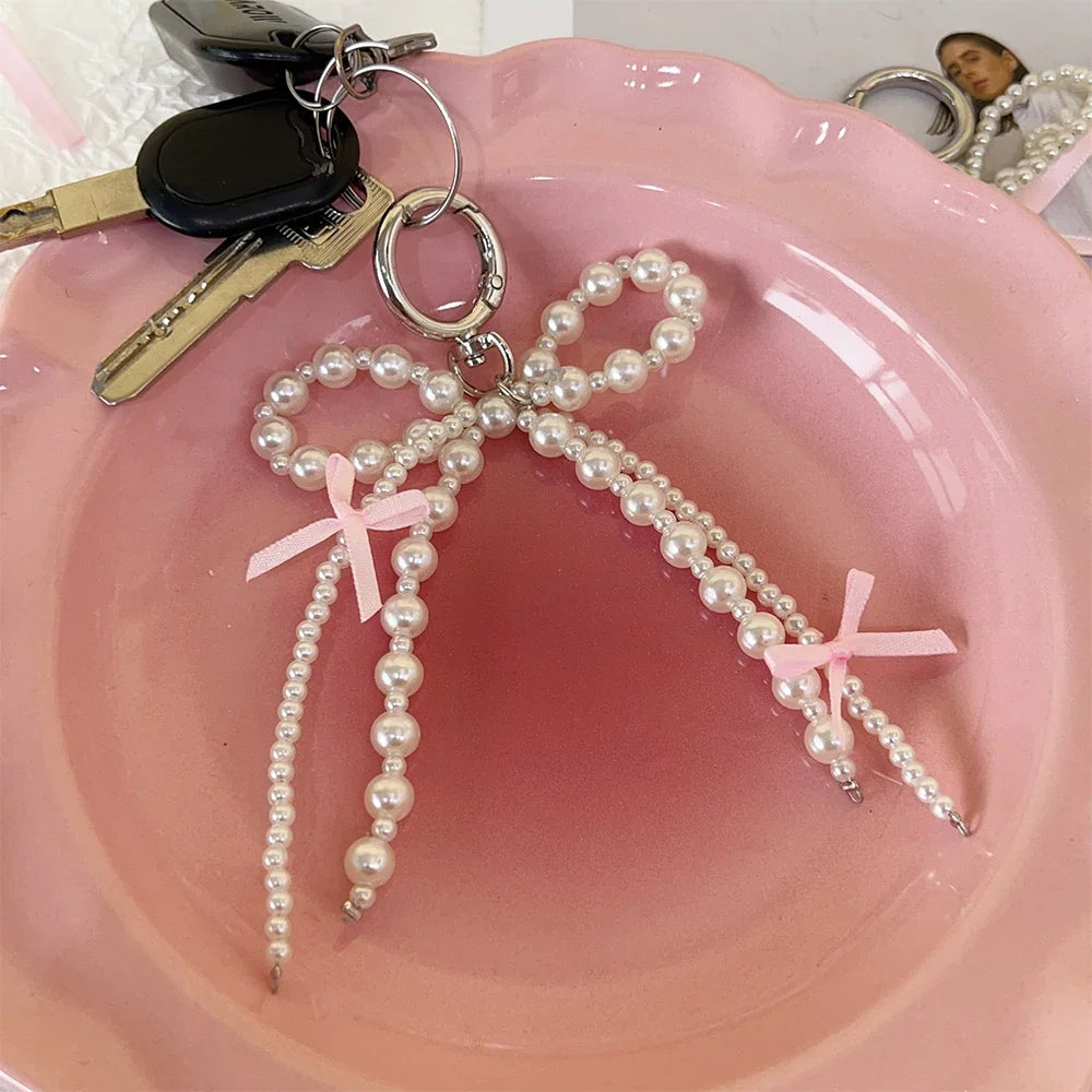 2026 New Korean Fashion Sweet Pearl Bow Keychain, Pearl Bow Keychain – Elegant Coquette Bag Charm with Pink Ribbon
