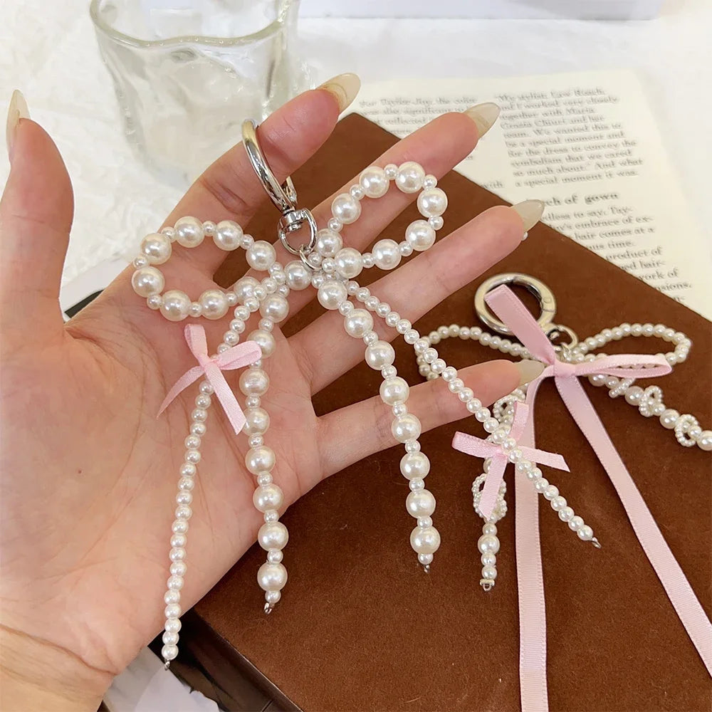 2026 New Korean Fashion Sweet Pearl Bow Keychain, Pearl Bow Keychain – Elegant Coquette Bag Charm with Pink Ribbon