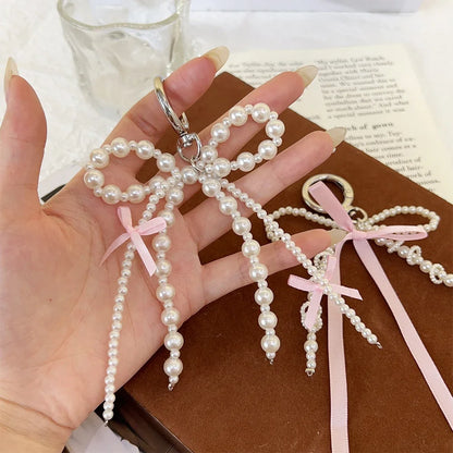 2026 New Korean Fashion Sweet Pearl Bow Keychain, Pearl Bow Keychain – Elegant Coquette Bag Charm with Pink Ribbon
