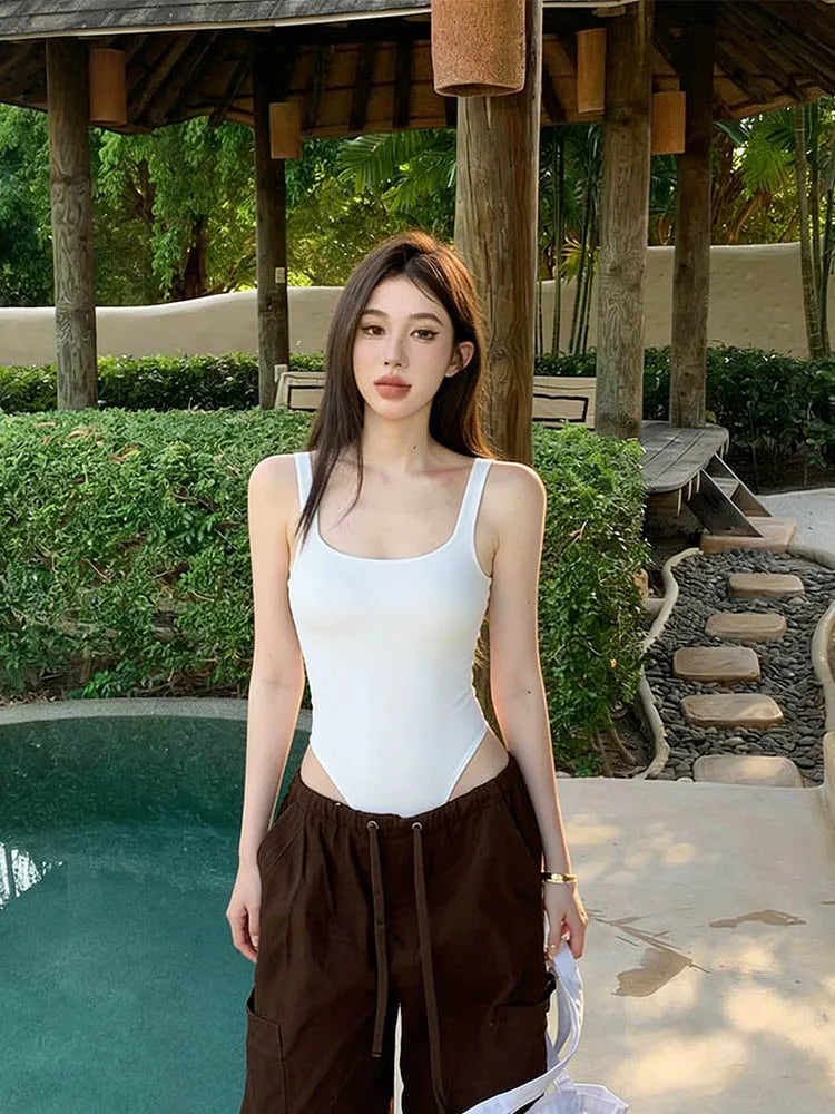 Sexy U-neck ribbed bodysuit with low cut, high waist & slim fit.Back straps & snap bottom. Perfect hot girl summer look!