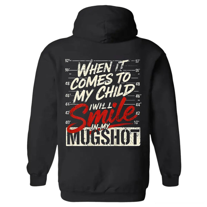 Protective Parent Hoodie – “I Will Smile In My Mugshot” Funny Graphic Hoodie