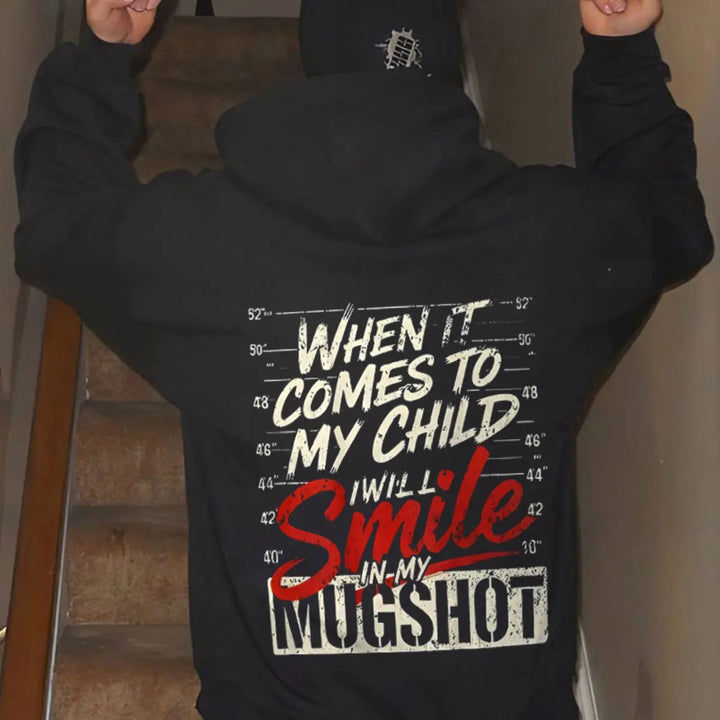 Protective Parent Hoodie – “I Will Smile In My Mugshot” Funny Graphic Hoodie